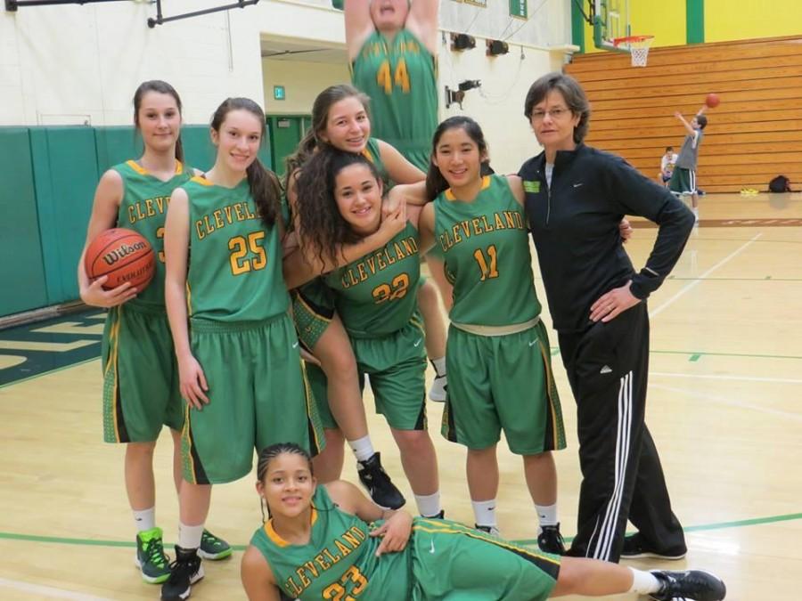 Hepburn (riding piggy back) with her team.