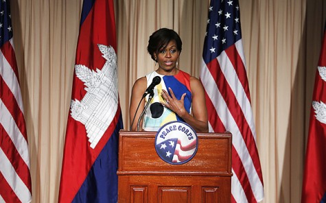 U.S. first lady Michelle Obama waves as she arrives to speak to the Peace Corps, Saturday, March 21, 2015, in Siem Reap, Cambodia. Mrs. Obama is in Cambodia to promote the education initiative "Let Girls Learn," which was launched to lift barriers that block more than 62 million girls around the world from attending school. (AP Photo/Wong Maye-E)