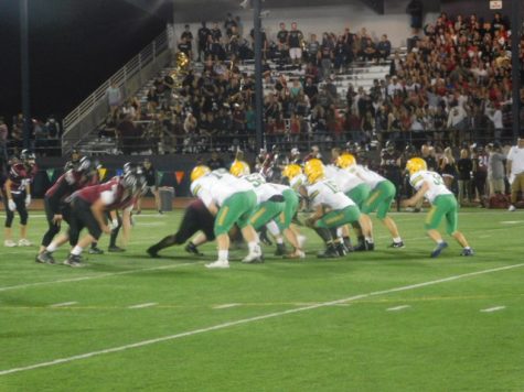 The Warriors offense takes the field against Glencoe. Photo by Scotty Douglass