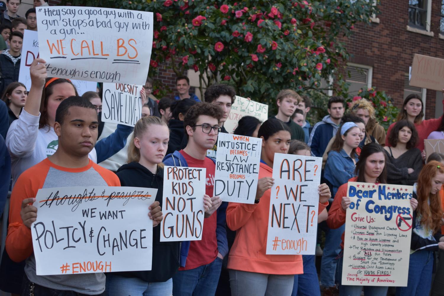 Students stand silently outside the school on March 14 for 17 minutes, honoring the 17 victims of the recent Florida school shooting and advocating for political action on ensuring safety in schools.