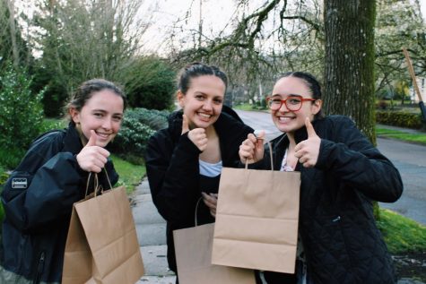 Club founder Stephanie Singh, on far right, alongside friends Sofia Higgins and Vivi Hurley ready to pass out care packages.
