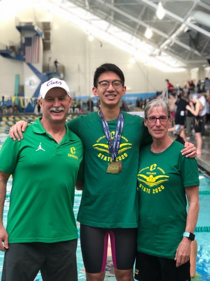 Cody Soo poses with his coaches Mark Wren and Mollie Starr