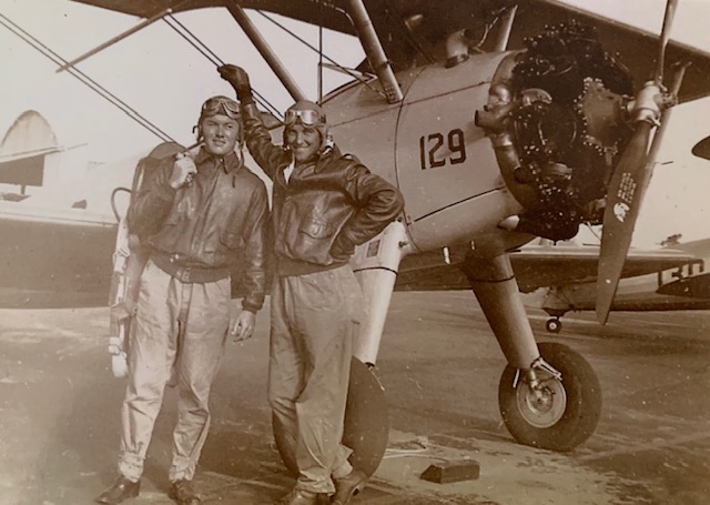 My great-grandfather, William Riley (right), with an unknown friend (left) standing in front of a plane during World War II.