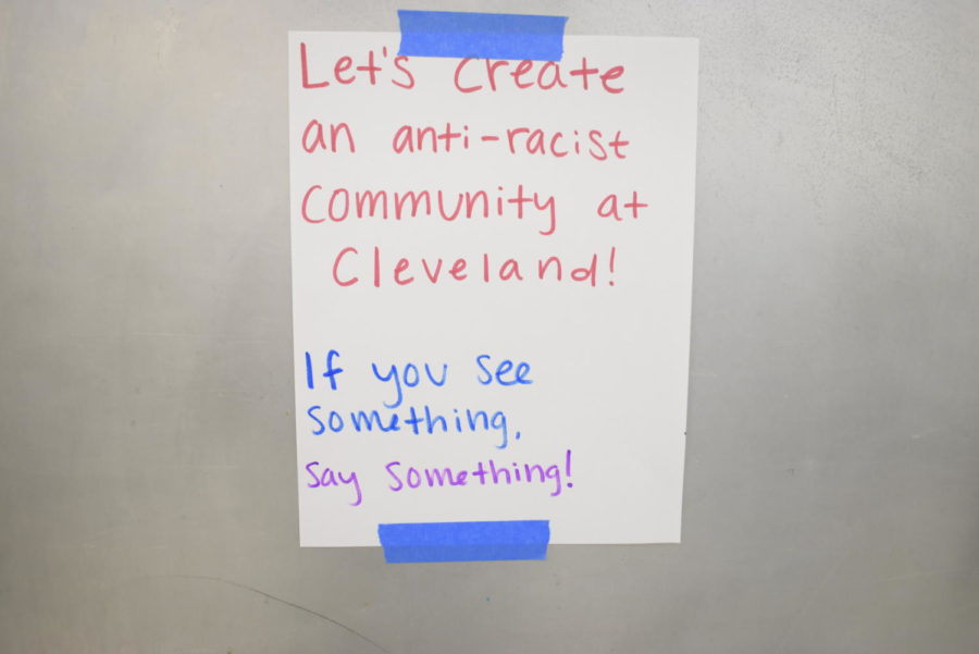 Posters taped to walls around the school and in the cafeteria urge students to create a better community.