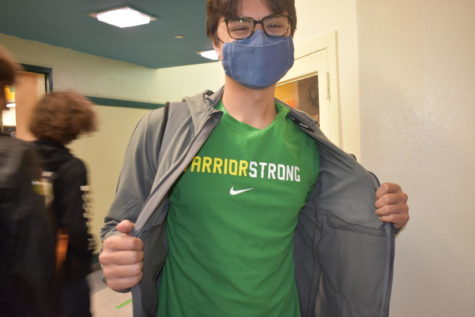 Liem Friel, senior, wears the school colors during green and yellow day.