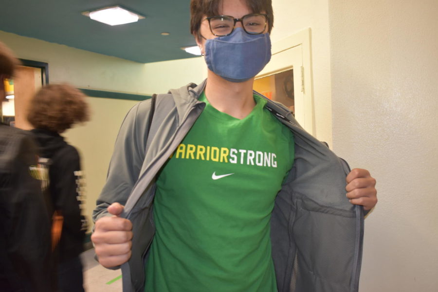 Liem Friel, senior, wears the school colors during green and yellow day.