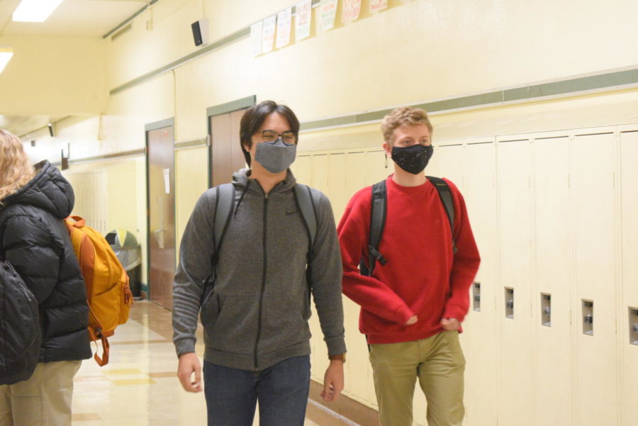 Seniors+Liem+Friel%2C+and+Aiden+Mackie+walking+down+the+hallways+at+Cleveland+following+mask+wearing+protocol.
