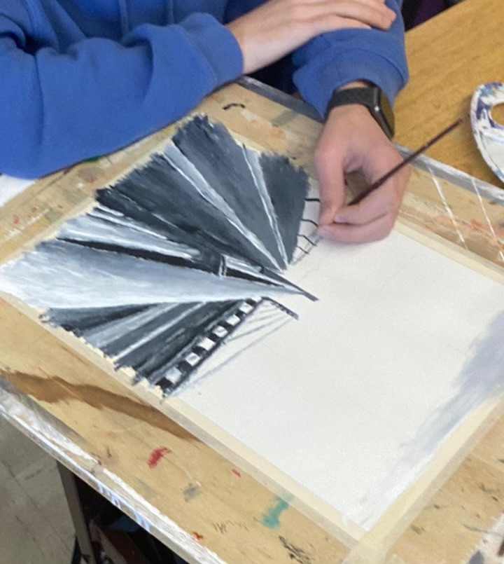 An IB Art student works on a final piece.