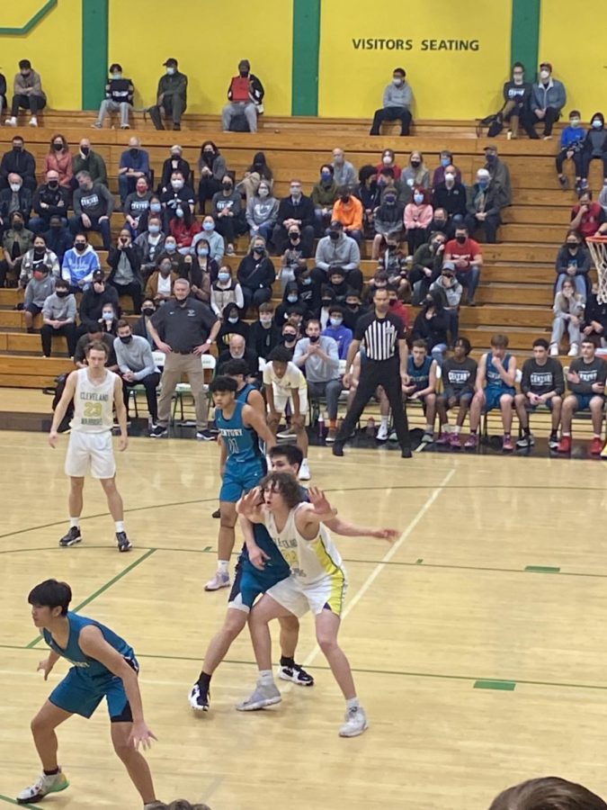 Jackson Cooper posts up against Century in the first round of the basketball playoffs. 