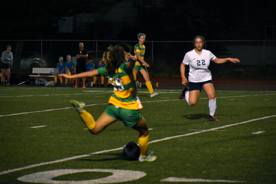 Sophomore Lola Pierce (19) goes for the goal during a game with St. Marys.