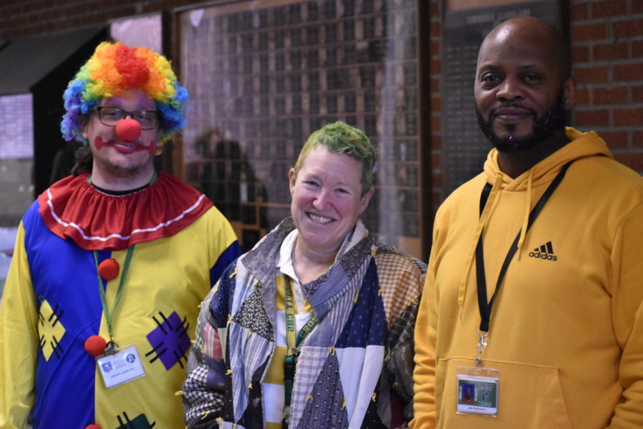 Teachers Kieran LeMeune (psychology), Mary Rodeback (English) and Jake Redmond (business), await their turn to be introduced at the CHS Gives Back assembly. LeMeune had to teach for a day in a clown suit, Rodeback dyed her hair, and Redmond got sprinkles in his beard. The teachers agreed to this because students raised more than $12,000 for the fundraiser.