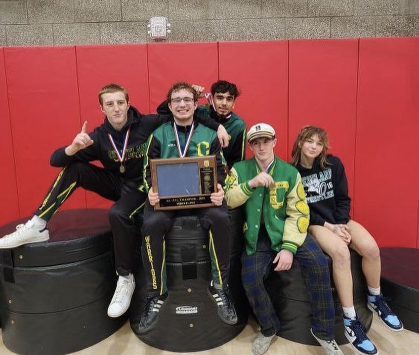 Warrior wrestlers who took first place at districts this weekend smile for the camera. (R-L: Connor Smeller, Josh Sonnichsen, Adrian Anaya, Logan Medford, Haley Vann)