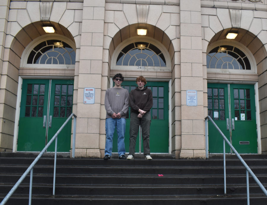 Debaters Nate Adamski and William Bransford standing outside Cleveland High School. The pair won the state title in Dual Interpretation.