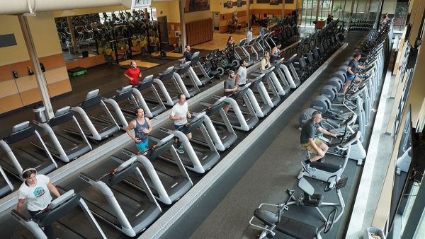 People exercising on the treadmills. 