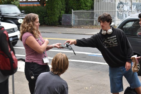 FREEDOM: VP Danielle Cota overseeing the opening of a Yondr pouch at the end of the day