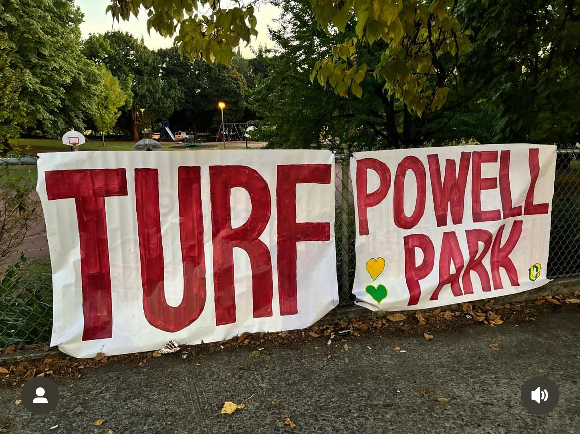 Sign hung by Cleveland parents requesting turf on Powell Park fields 