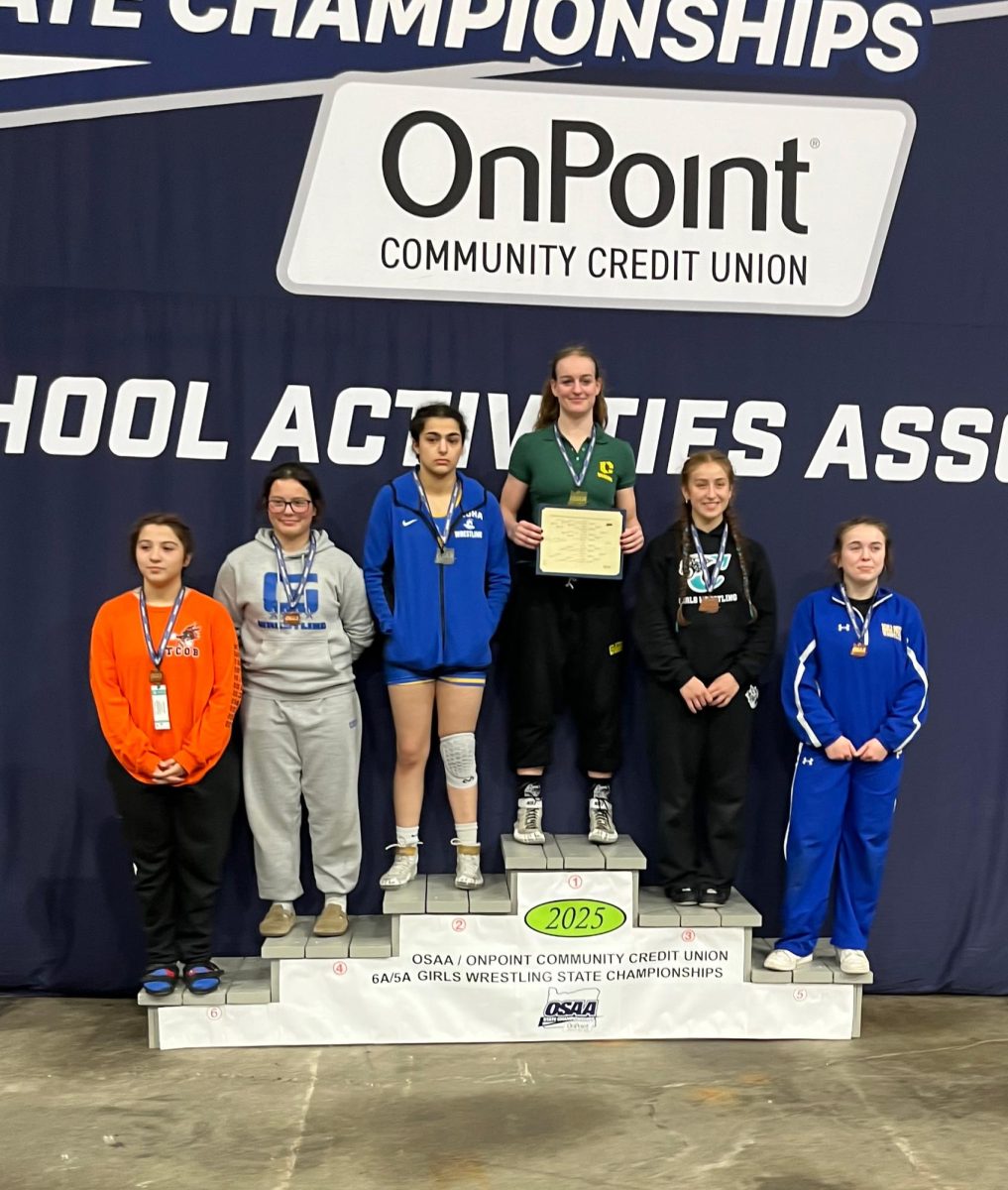 Izzy Herring at the top of the podium, placing first at state for the second year in a row. 