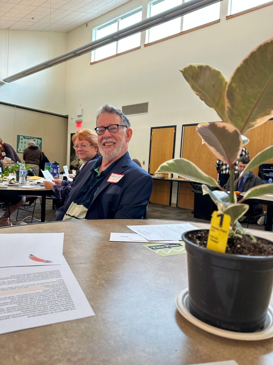 Hector Cobb waits to accept the award for substitute of the year at Chemeketa Community College on Saturday, Oct. 11.