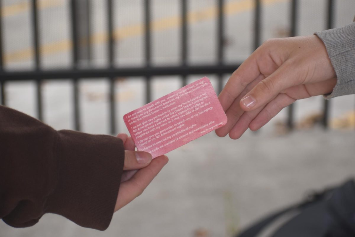 Students passing a Red Card. 