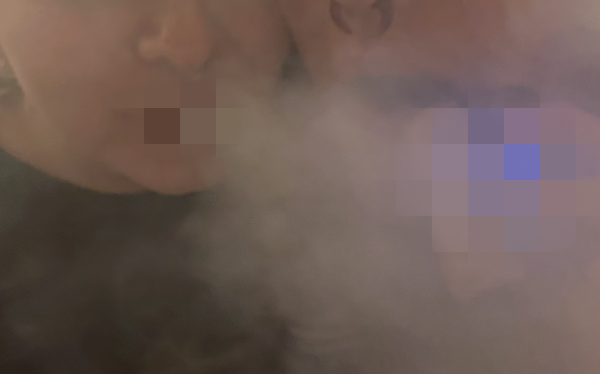 Two people vaping.