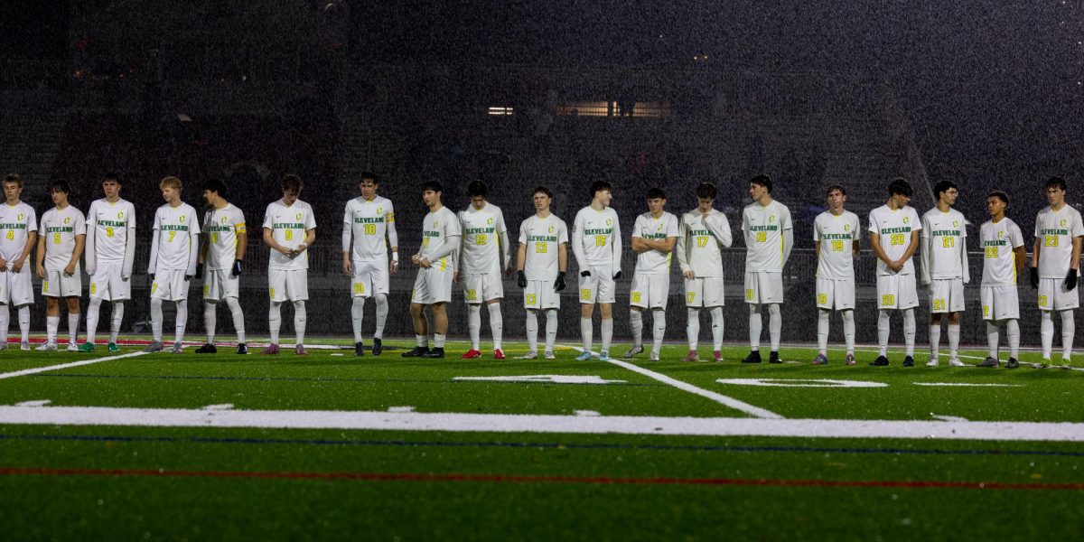 Full Cleveland Boys Varsity team during national anthem leading up to game vs Lincoln