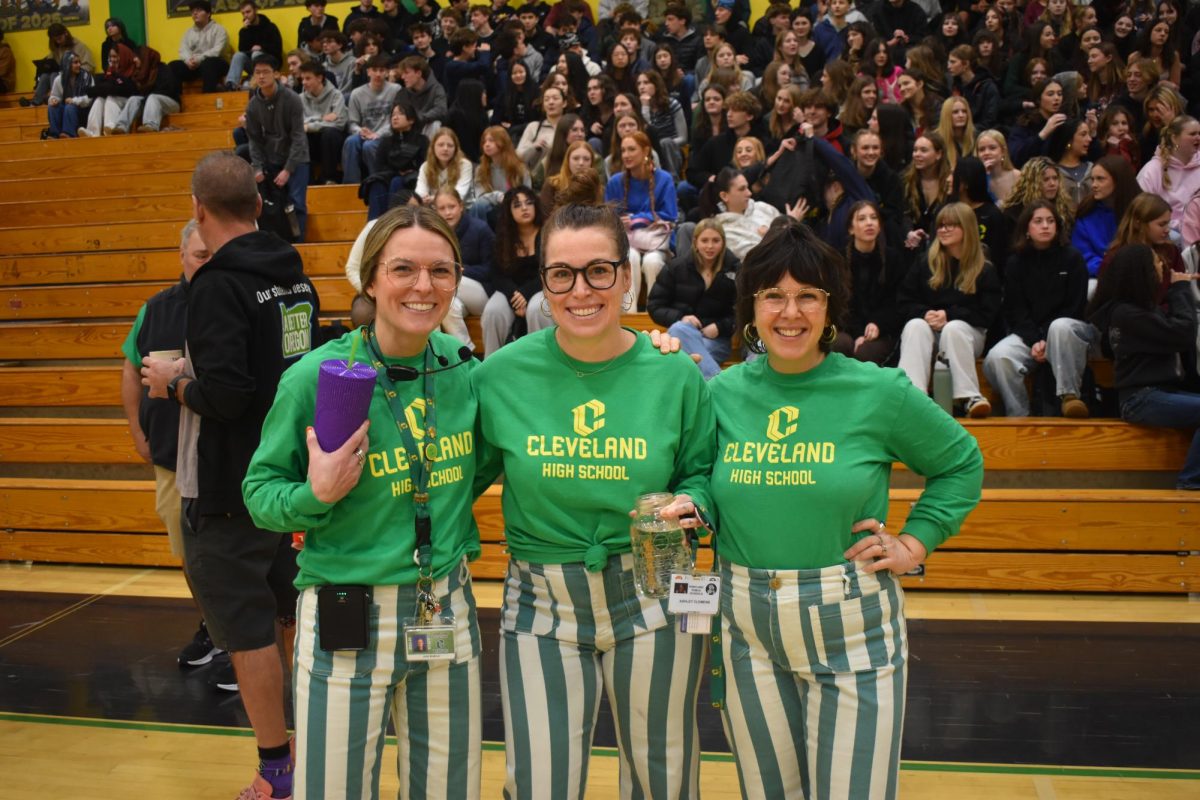 Teachers Julia Blattner, Ashley Clemens, and Jessie Eller-Isaacs at Cleveland Gives Back Assembly.