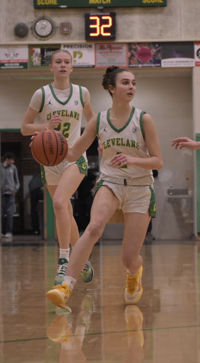 Cate Kelly driving to the hoop