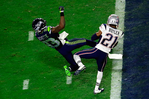 GLENDALE, AZ - FEBRUARY 01:  Malcolm Butler #21 of the New England Patriots intercepts a pass by  Russell Wilson #3 of the Seattle Seahawks intended for  Ricardo Lockette #83 late in the fourth quarter during Super Bowl XLIX at University of Phoenix Stadium on February 1, 2015 in Glendale, Arizona.  (Photo by Jamie Squire/Getty Images)
