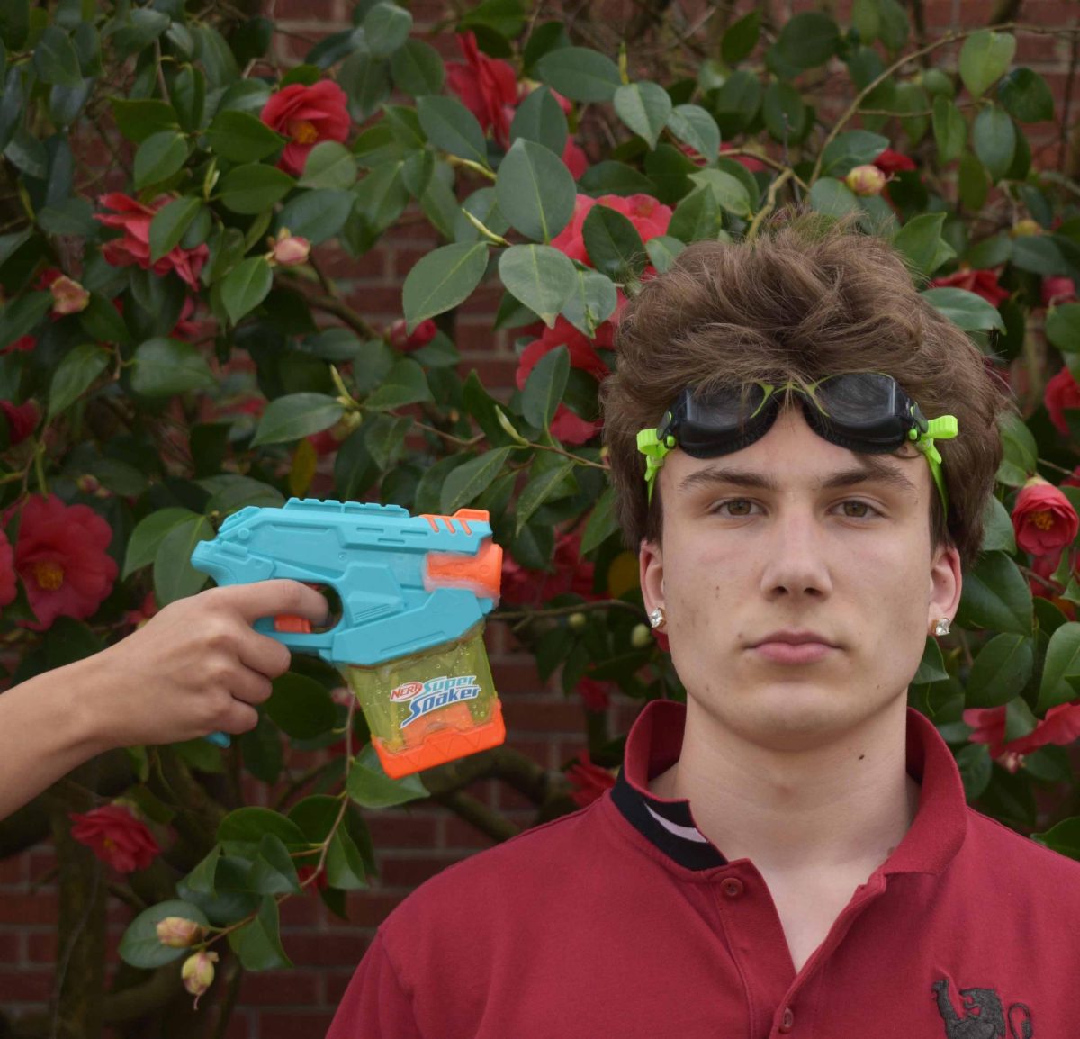 Dante Cast, a senior, with a goggles on his head, a common use of protection used by seniors when playing Senior Assasin.
